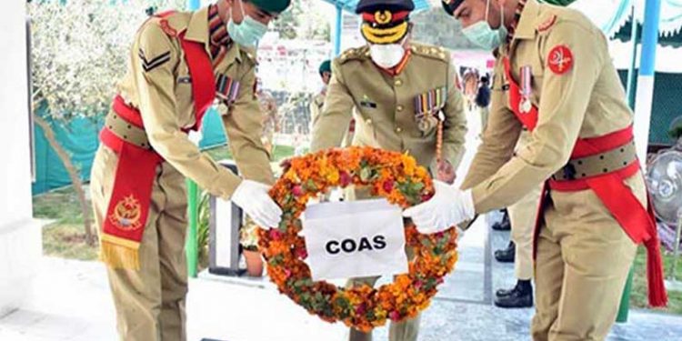 Flowers laid at graves of Karnal Sher Khan, Lalak Jan on behalf of COAS